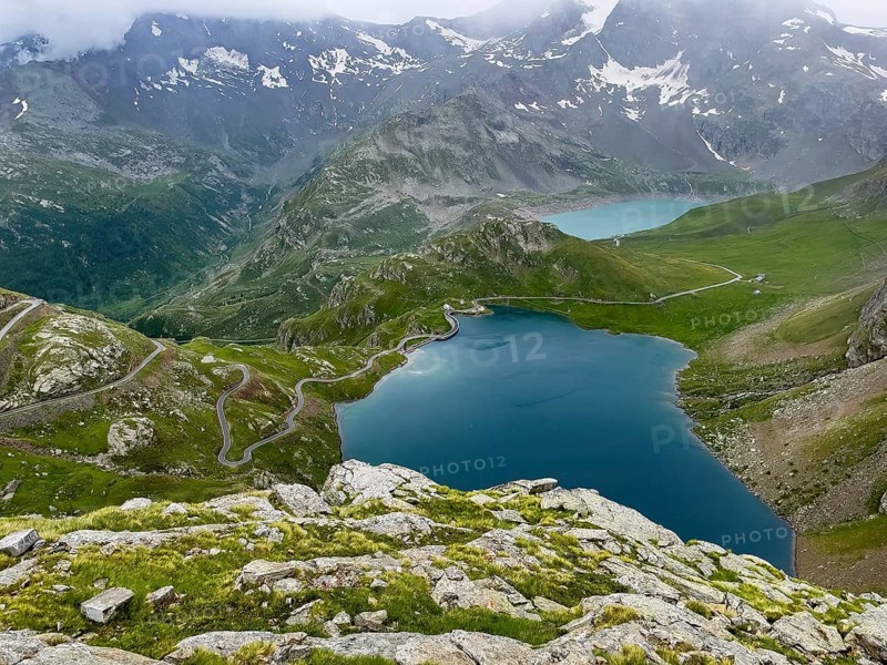 View from panoramic point at Colle del Nivolet on Lago Agnel in front