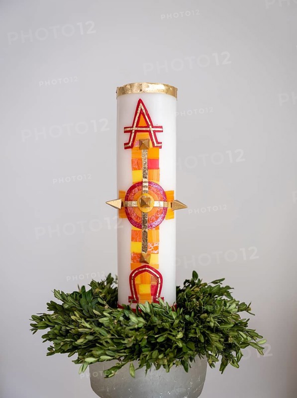 Large candle with alpha and omega signs in Germany's first private ecumenical motorway church 'Geiselwind Licht auf unserem Weg' on the A 3 between Wuerzburg and Nuremberg