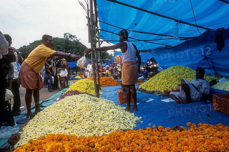 A flower market in plotform during Onam festival in Thrissur or Trichur