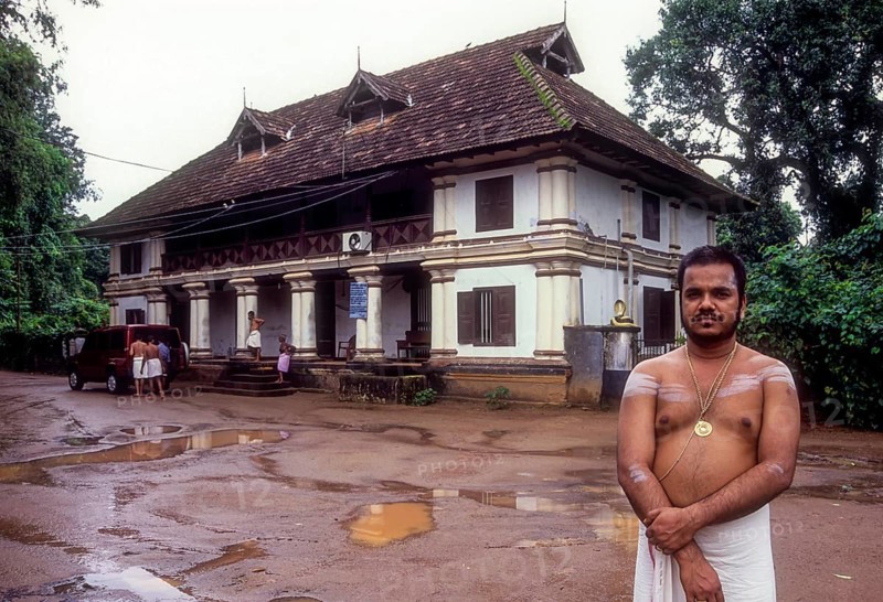 Nambudiri Priest standing in front of Pambummekkatu Mana Nagaraja Temple