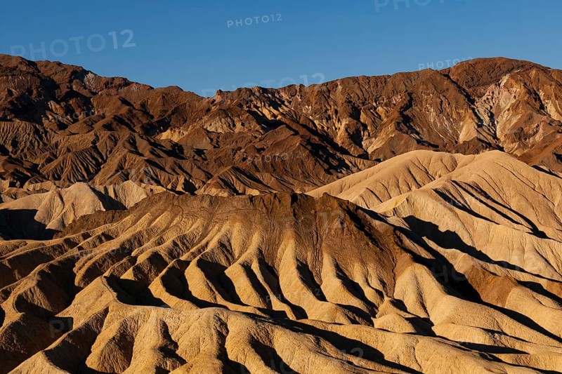 Coloured rock formations in the evening light at Zabriskie Point