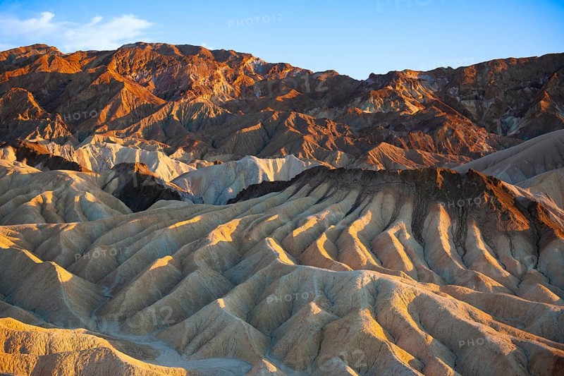 Coloured rock formations in the evening light at Zabriskie Point