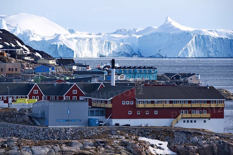 Icefjord and houses in the town of Ilulissat