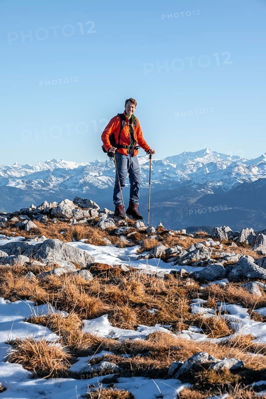 Mountaineer in front of mountain panorama