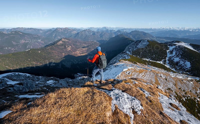 Climbers on the summit ridge with first snow in autumn