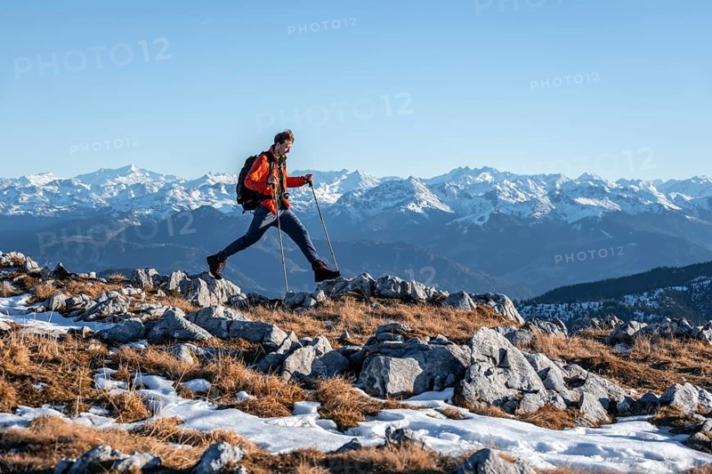 Mountaineer taking a big step
