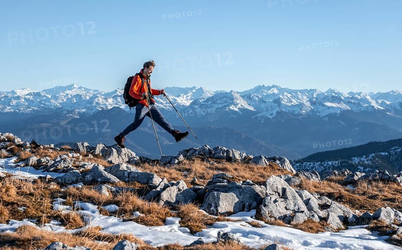 Mountaineer taking a big step