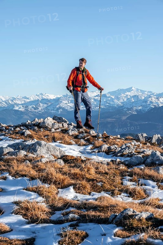 Mountaineer in front of mountain panorama