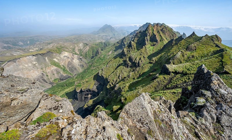 Pointed green mountain peaks on the ridge of Tindfjoell