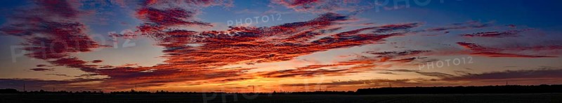 Sunset with red coloured clouds on the evening of the solstice