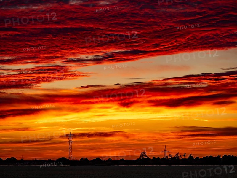 Sunset with red coloured clouds on the evening of the solstice