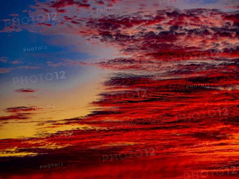 Sunset with red coloured clouds on the evening of the solstice