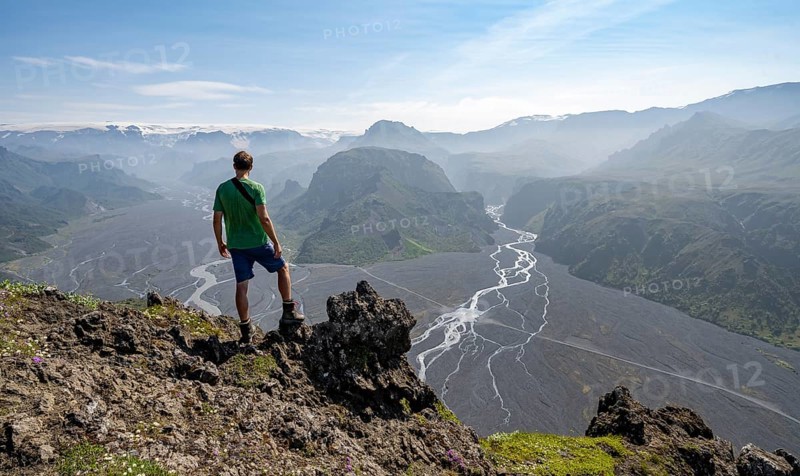 Hikers in front of mountain landscape