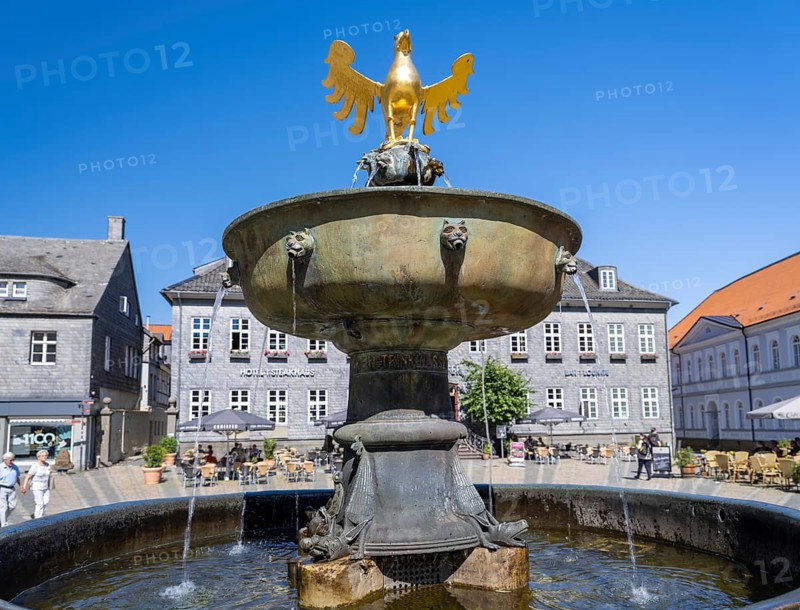 Golden eagle on the market fountain in front of the Kaiserringhaus on the market square