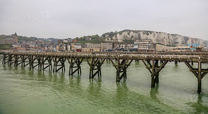 Coastal village of Le Treport at the mouth of the Bresle on the English Channel with Europe's highest chalk cliff and Saint-Jacques church