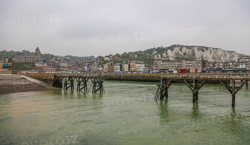 Coastal village of Le Treport at the mouth of the Bresle on the English Channel with Europe's highest chalk cliff and Saint-Jacques church