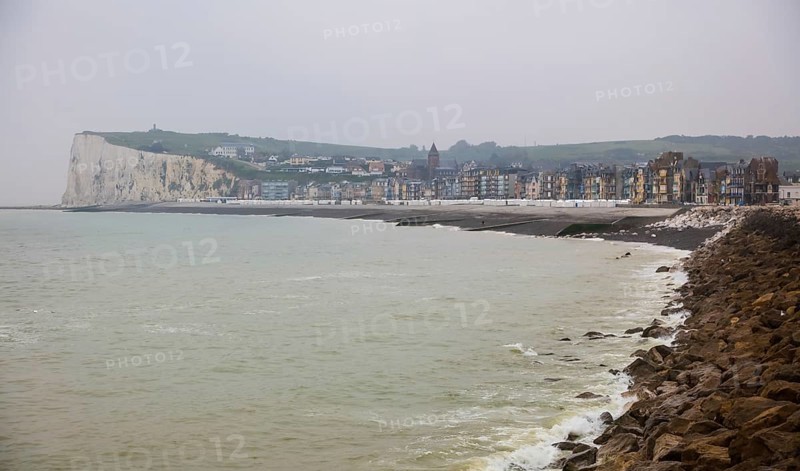 View from the coastal village of Le Treport at the mouth of the Bresle on the English Channel to Mers-les-Bains in the Somme department with the chalk cliff