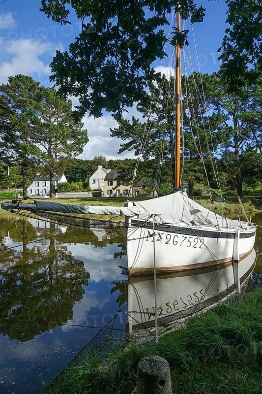 Historic sailing boat in the old harbour Pont Kalleg at the end of the inlet Anse du Moulin Neuf