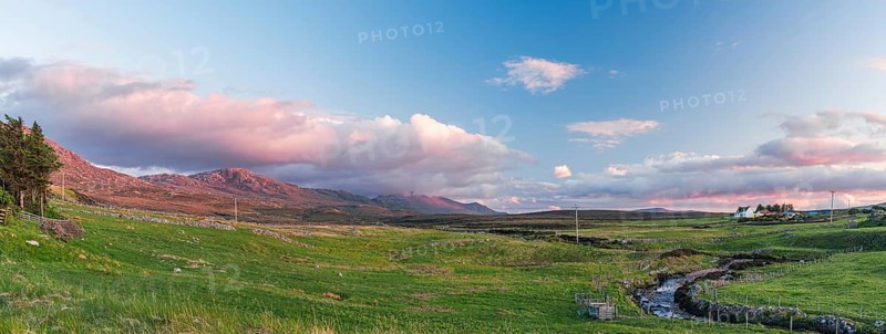 Sunset of Mountain and Meadows over Smoo Cave