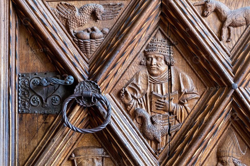 Richly decorated wooden portal of the collegiate parish church of St. Philip and St. James