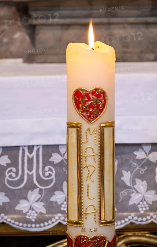 Candle with red heart and the inscription Maria in the collegiate parish church of St. Philipp and Jakob