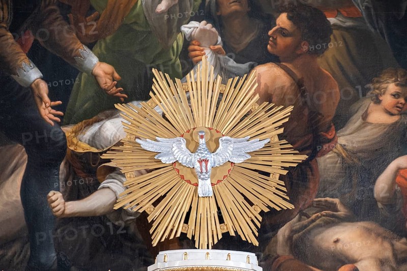 Pentecost dove in front of the altarpiece in the high altar of the collegiate parish church of St. Philip and St. James in Altoetting