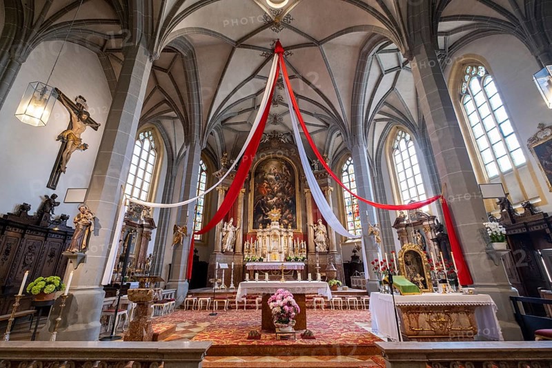 High altar of the collegiate parish church of St. Philip and St. James in the pilgrimage town of Altoetting. On the right