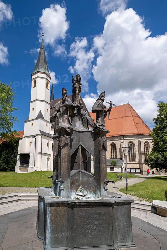 Fountain in front of the collegiate parish church of St. Philip and St. James in the pilgrimage town of Altoetting. The fountain was erected to mark the 1250th anniversary of the establishment of the four dioceses of Regensburg