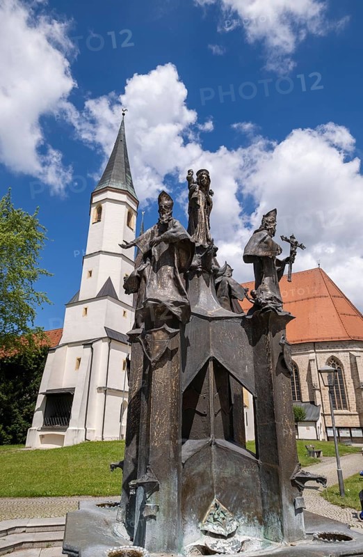 Fountain in front of the collegiate parish church of St. Philip and St. James in the pilgrimage town of Altoetting. The fountain was erected to mark the 1250th anniversary of the establishment of the four dioceses of Regensburg