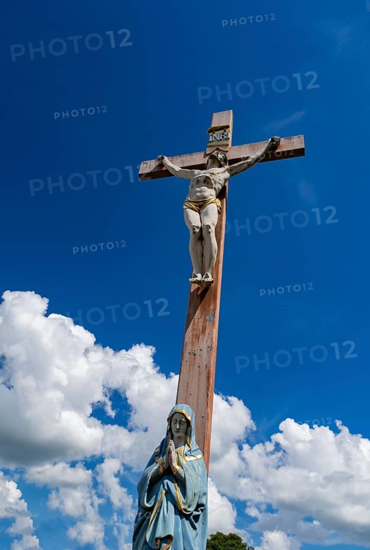 Figure of the Virgin Mary on a wooden cross with crucifix at the St. Michael cemetery
