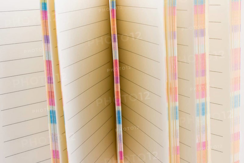 Pink notebook on a white background