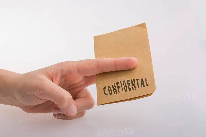 Brown paper text confidental on a white background