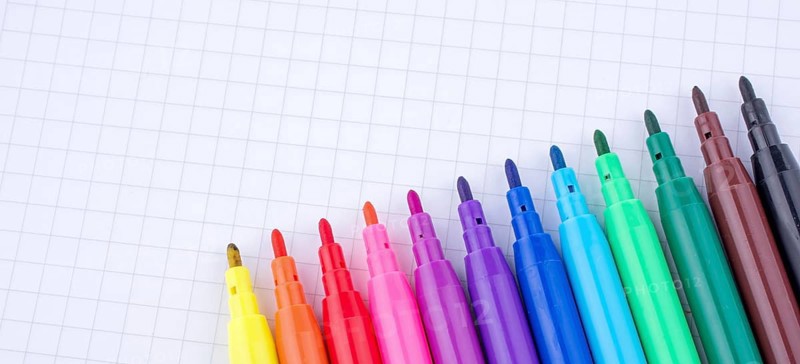 Colorful felt-tip pens on a notebook