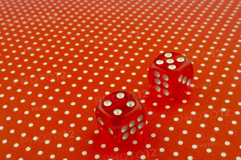Red dice on a red background