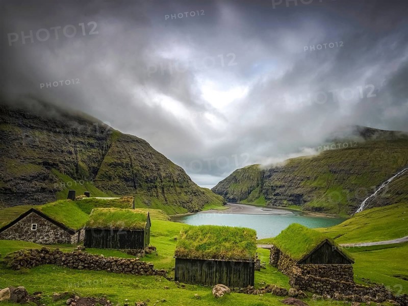 Small houses near a blue lake