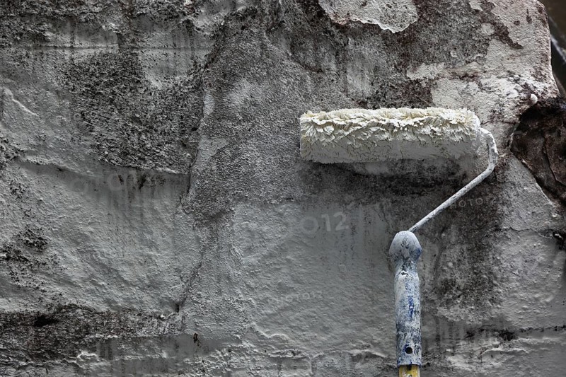 Wall is painted white with paint roller