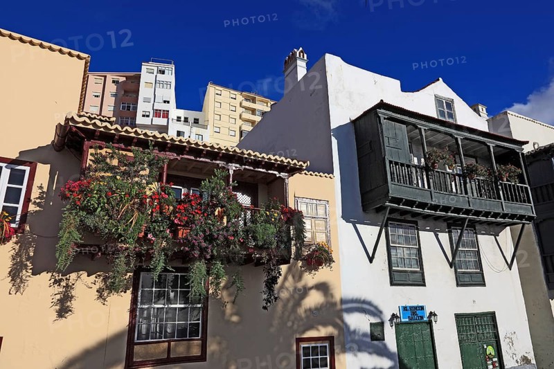 Balconies decorated with flowers on the houses of the Avenida Maritima of the city of Santa Cruz de la Palma