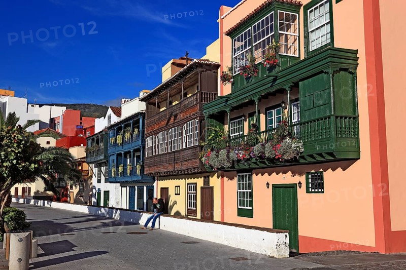 Balconies decorated with flowers on the houses of the Avenida Maritima of the city of Santa Cruz de la Palma