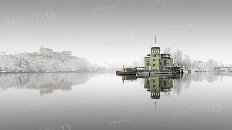 Snowfall and fog at the Helmovsky Jez hydroelectric power plant power station in Prague