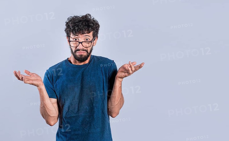 Man spreading palms, feeling clueless and uncertain