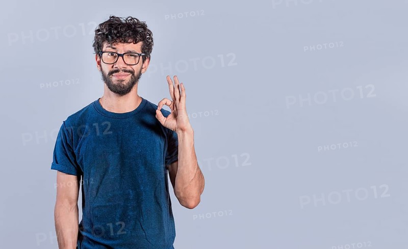 Handsome man gesturing everything is ok, Person making ok gesture