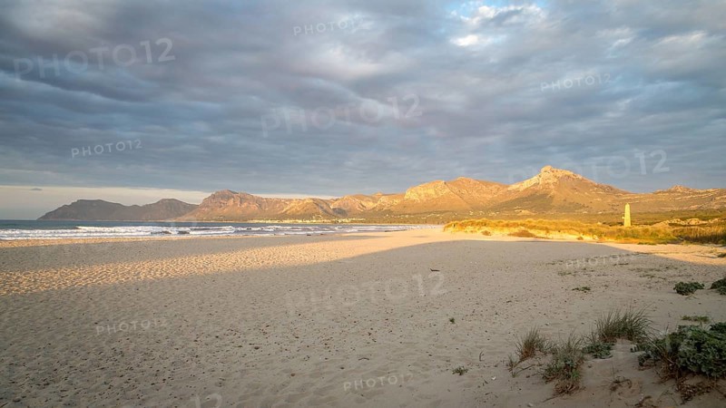 Evening atmosphere at the sandy beach Playa Sa Canova in Son Serra de Marina, in the back mountains Serres de Llevant