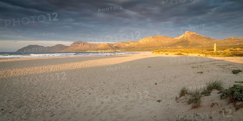 Evening atmosphere at the sandy beach Playa Sa Canova in Son Serra de Marina, in the back mountains Serres de Llevant