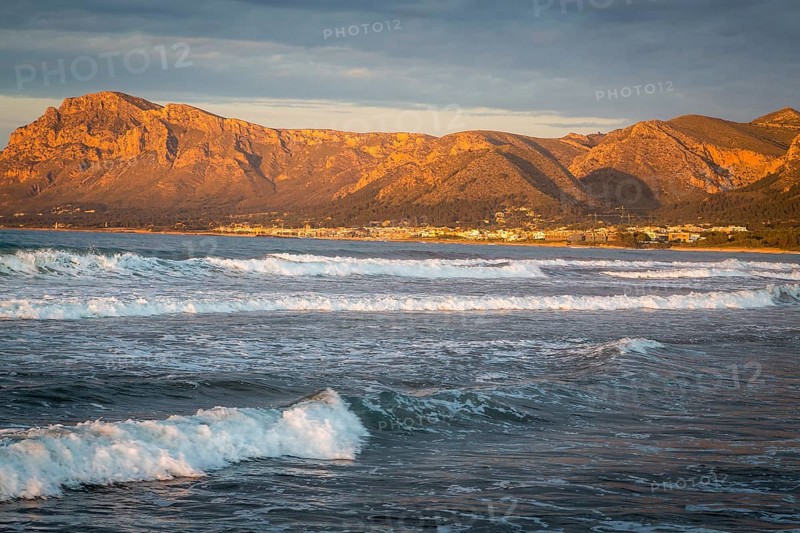 Colonia de Sant Pere in the evening light, waves in front