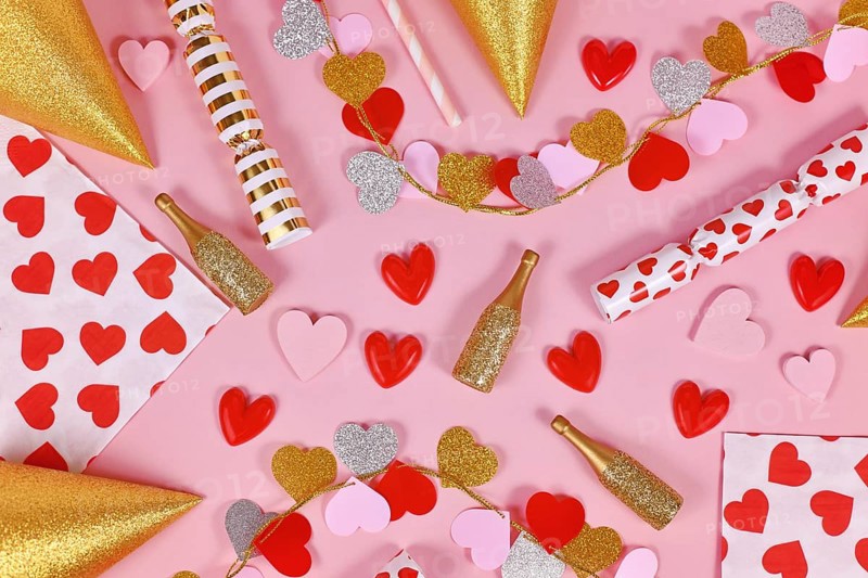 Party flat lay with heart garland, napkin
