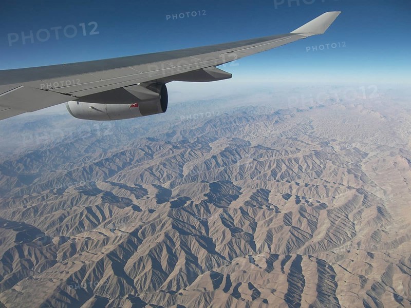 View from the plane of the inhospitable mountainous country in the region of Afghanistan, Pakistan