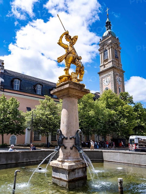 Sculpture of St. George with gilded armour as dragon slayer at St. George's Fountain in front of the Georgenkirche, Eisenach