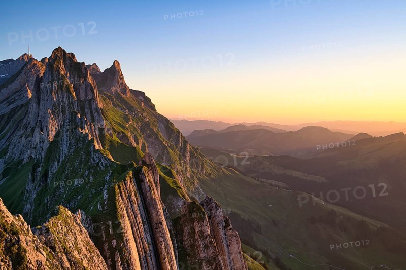 Alpstein mountains with ridge in the evening light, cloudless sky over Appenzellerland