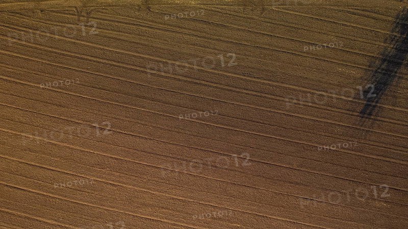 Aerial view of plowed agricultural field ready for planting,