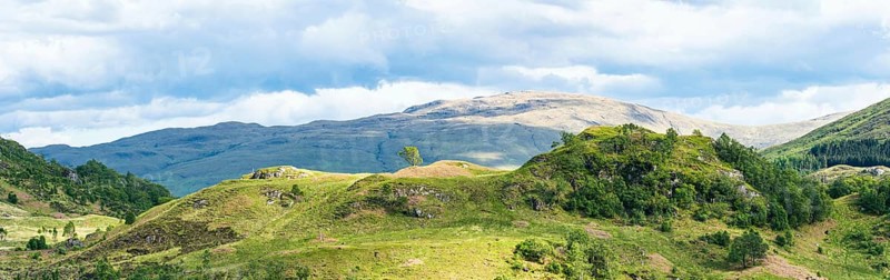 Panorama of Mountains in Lights and Shadows over Glenfinnan Viaduct, West Highland Line in Glenfinnan